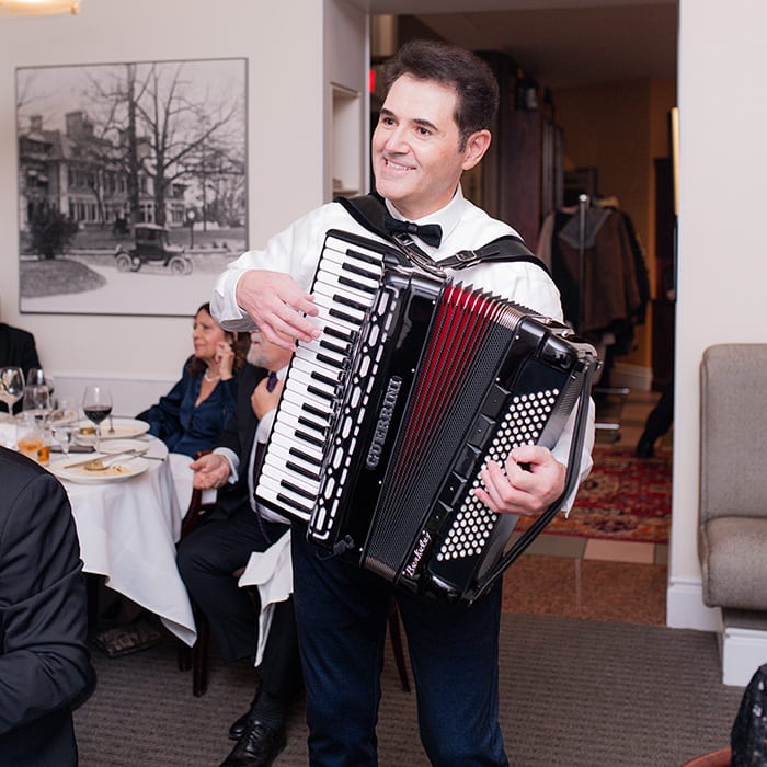 Lucio Raggiunti performing standing at an event